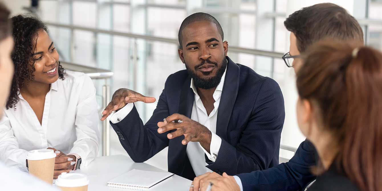 agileblogftimg | JLL Technologies Black and White business people at a conference table