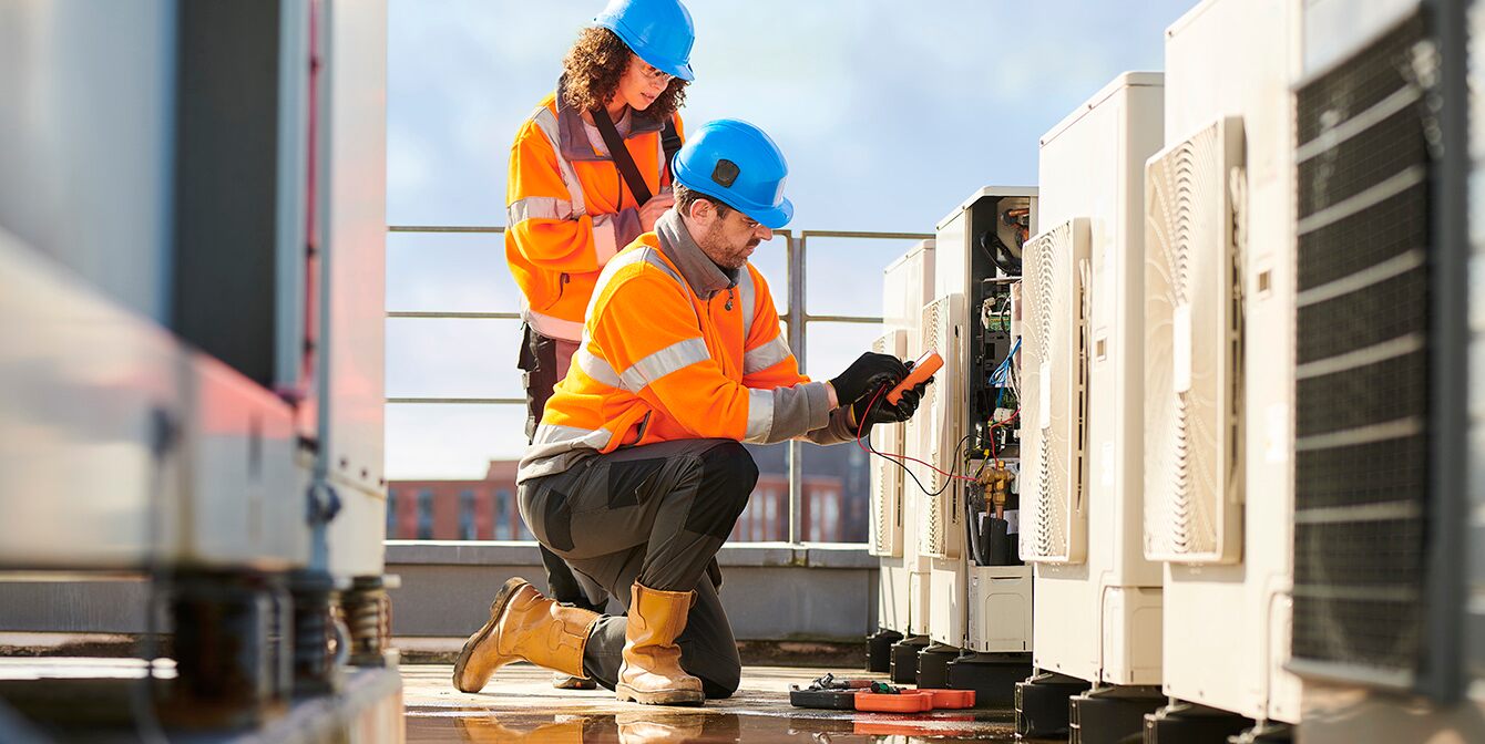 | JLL Technologies facilities manager work on ac uniti