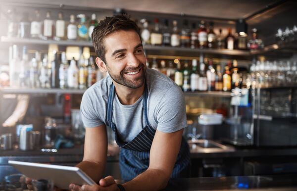 Restaurant employee serving customers showing uptime of key assets and all equipment in the facility running.