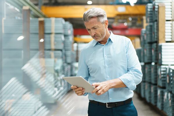 Facility manager uses Corrigo Enterprise on a tablet to monitor open work orders and identify location of assets.