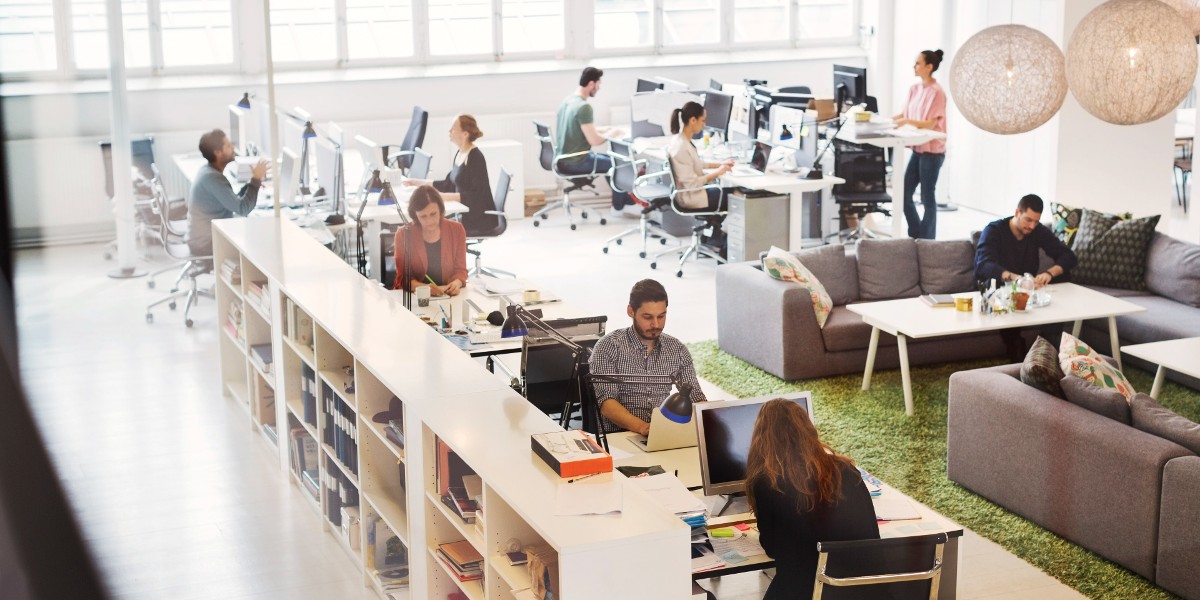 consumer tech customer story | JLL Technologies business people work in bright open plan office space
