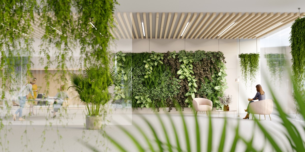 cresustainabilitytrendspowerofdata | JLL Technologies business women working in sustainable office surrounded by green foliage