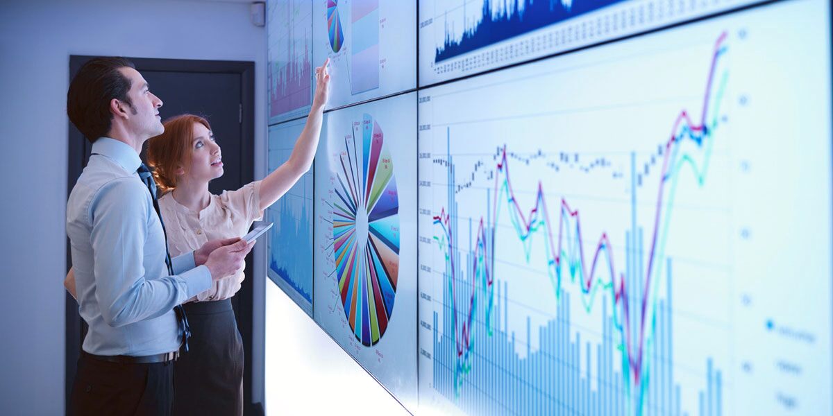 two people looking at data and insights dashboards